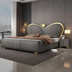 lit double moderne gris capitonné table chevet oreillers tapis luxueux