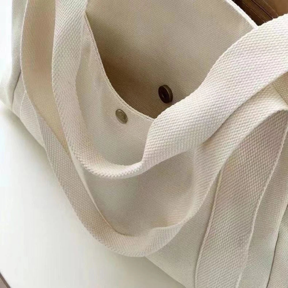 sac main toile beige clair poches poignées détachables moderne casual