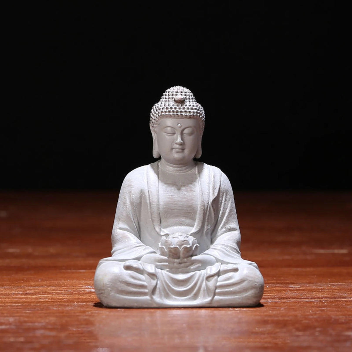 statue bouddha zen blanc gris bois décoratif assiette cigarettes tapis fibres naturellements éléments divers