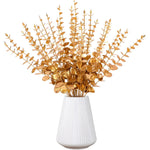 bouquet artificiel feuilles vertes naturel minimaliste ruban blanc vase blanc tapis beige ornement extérieur
