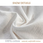 Gros plan sur une texture de tissu en coton blanc doux et léger, offrant un confort agréable au toucher.