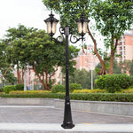 lampadaire extérieur or noir verre translucide vintage élégant détails sculptés deux lampes abat jours