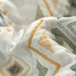 Détail du tissage Jacquard de la couverture en coton gaze