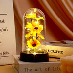 décoration florale cloche verre fleurs jaunes tige verte base noire guirlande led lumineuse romantique