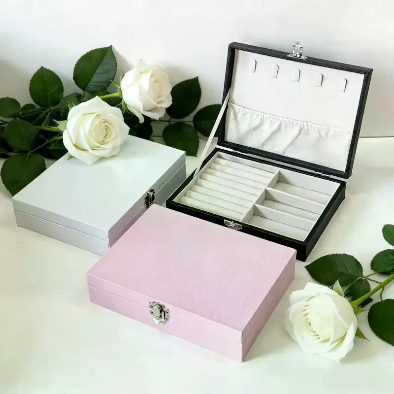 boîte bijoux simili cuir noir blanc rose compartiments cadenas classique organisation sécurité