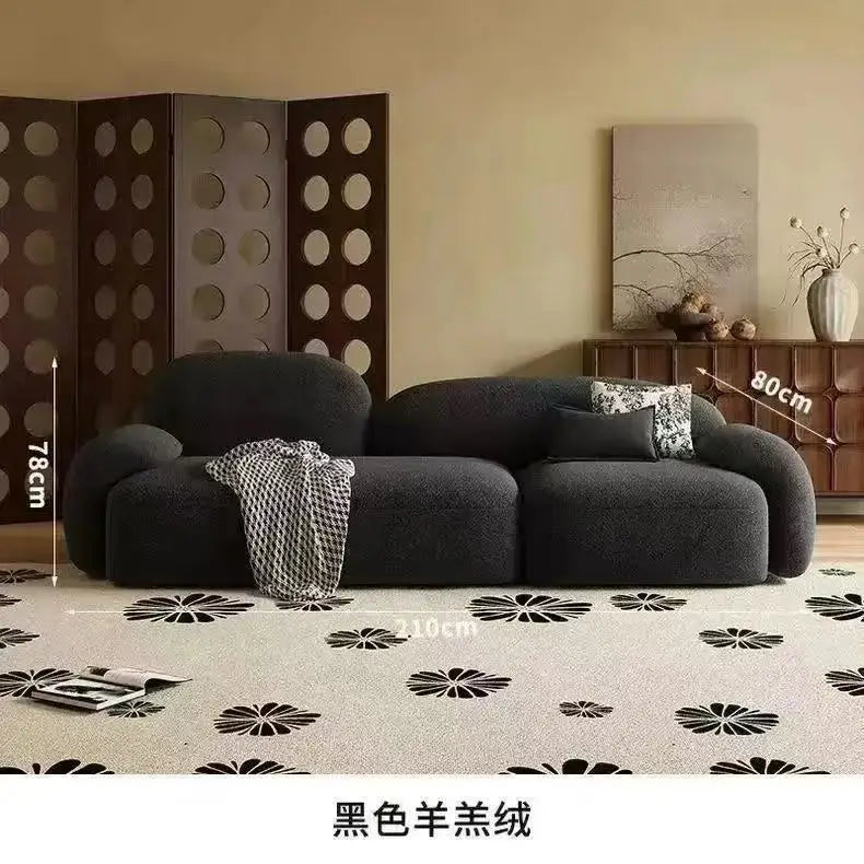 canapé moderne noir blanc fleurs motifs abstraits coussins plateau bois minimaliste italien scandinave