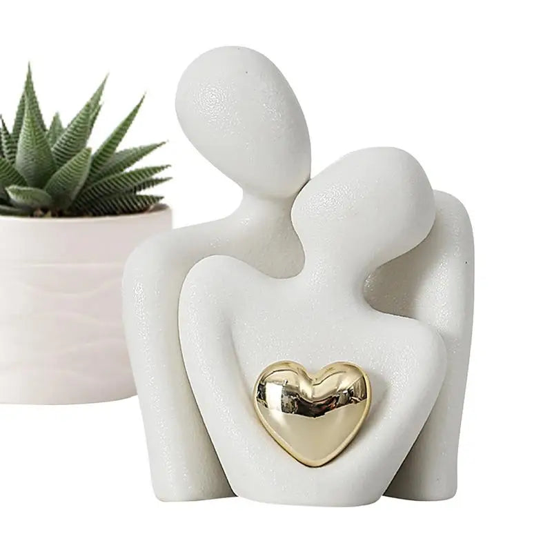statuette couple stylisé blanc noir cœur doré moderne minimaliste or texturée aspect granuleux