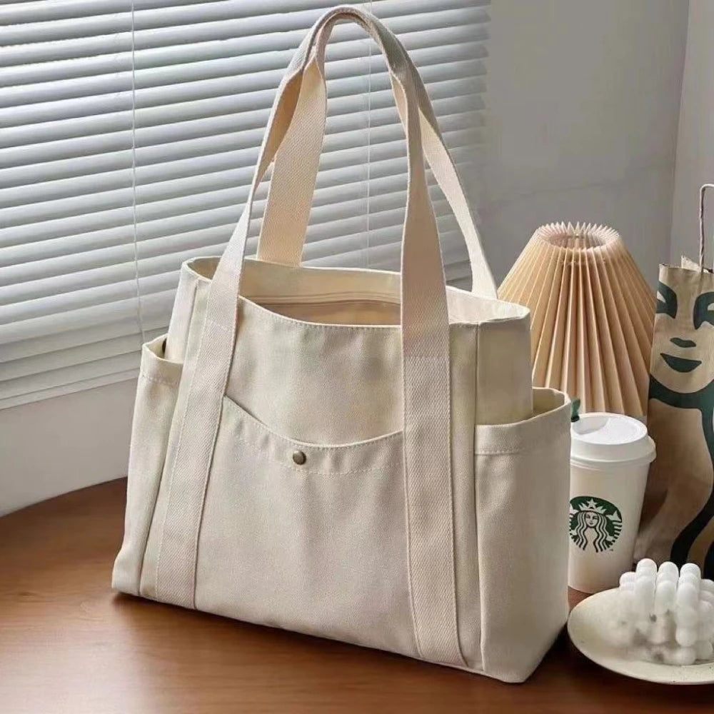sac main toile beige clair poches poignées détachables moderne casual