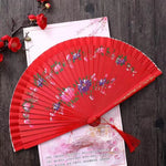 éventail pliant bois ajouré double face fleurs colorées ruban pompon rouge rose bleu vert
