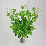 plantes artificielles violet vert marron feuilles ovales moderne décoration extérieure vase galets noirs blancs