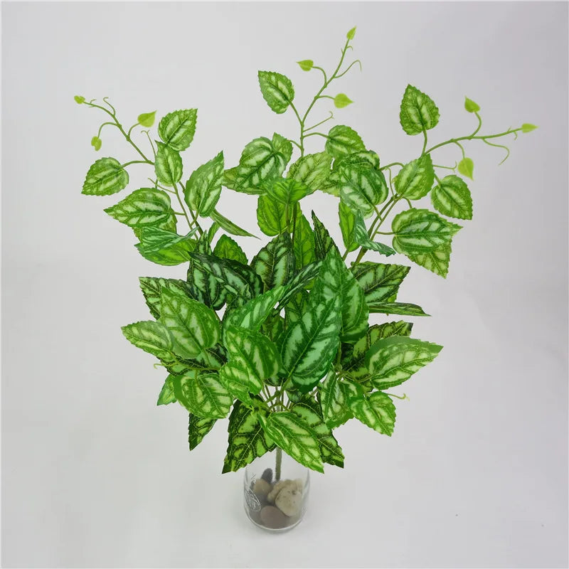 plantes artificielles violet vert marron feuilles ovales moderne décoration extérieure vase galets noirs blancs