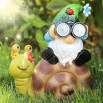 décoration jardin gnome limace résine éclairage solaire vert bleu marron fleurs coccinelle lunettes