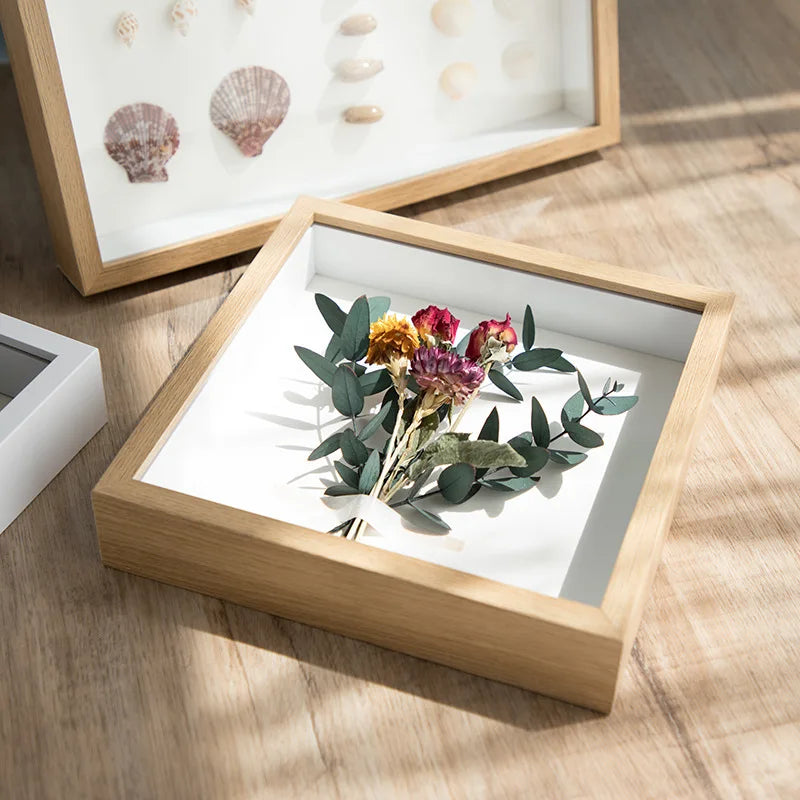 cadres profonds bois clair fleurs séchées coquillages vitre transparente rustique minimaliste