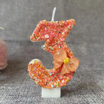 bougie anniversaire chiffre orange paillettes multicolores décoration brillante fleur centroide