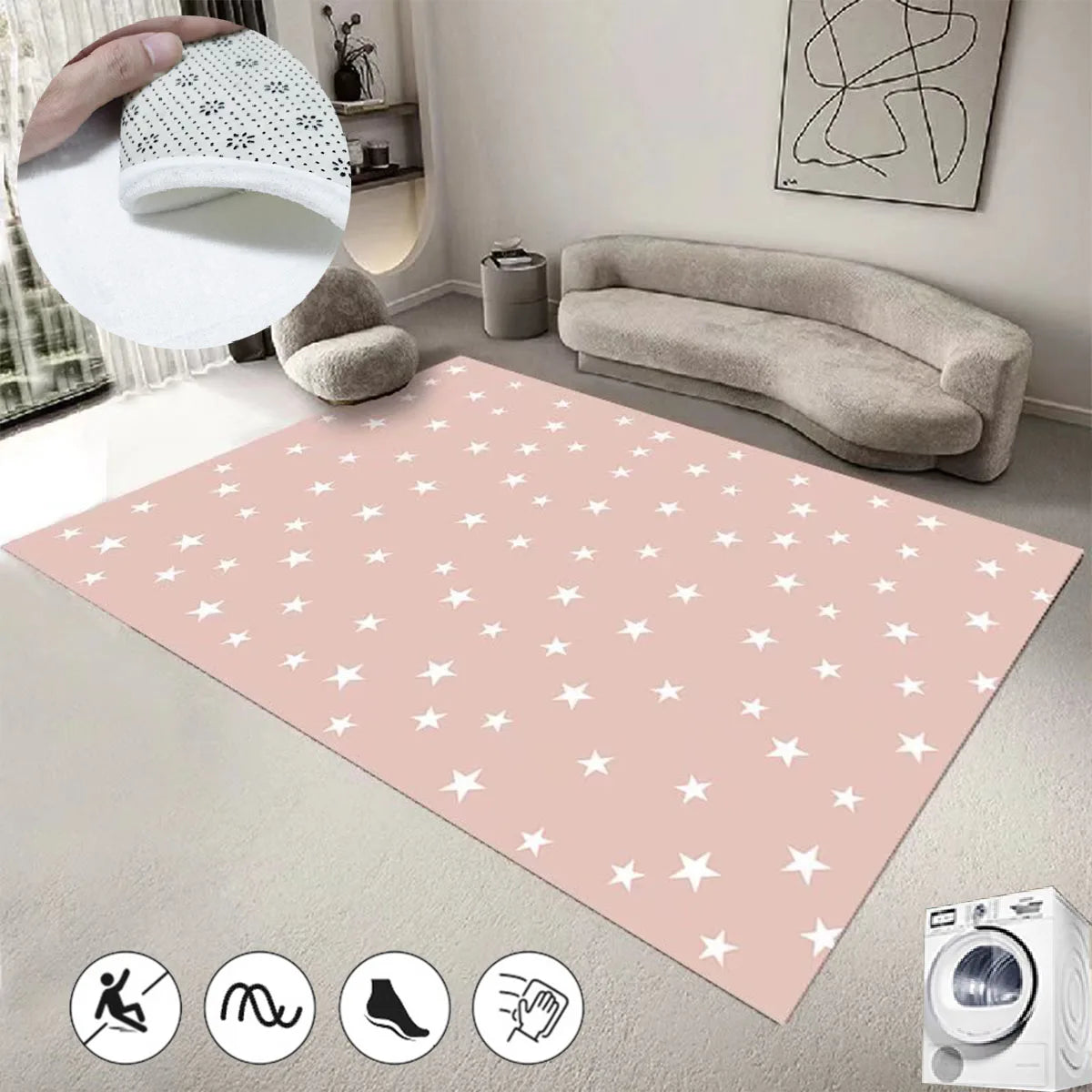 Un tapis rose à motifs d'étoiles blanches, agrémenté de coussins gris, d'une lampe suspendue et d'un canapé confortable, créant une ambiance chaleureuse et apaisante dans cette pièce.