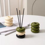 diffuseur huiles essentielles moderne minimaliste rouge jaune bleu noir beige vert géométrique circulaire brillant