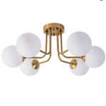 luminaire moderne or noir globes verre opaques semi suspendus métal