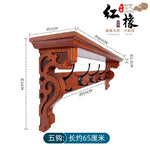 porte manteau étagère murale bois marron foncé crochets décor sculpté motifs floraux classique vis