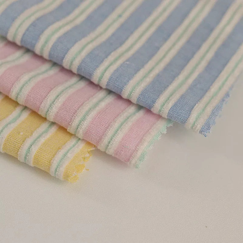 tissu rayé coton polyester bleu rose jaune décontracté pastel opalescent vertical fin rapide respirant