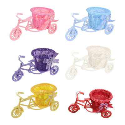 Jardinière tricycle vintage rose avec fleurs artificielles