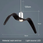 suspension lumineuse moderne oiseau stylisé blanc noir éclairage salon chambre led résine intérieur