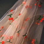 tissu polyester brodé fruits rouges verts transparent broderie blanc roseclair