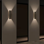 applique murale moderne pierre gris clair aspect granitique led chambre entrée étude interrupteur bouton