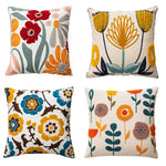coussins carrés brodés motifs floraux modernes toile blanc jaune vert rouge bleu opaques