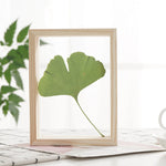 cadre photo bois double face nature morte feuilles brindilles ours peluche minimaliste deco maison