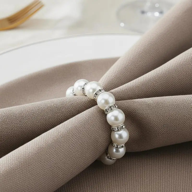 anneau serviette strass dorés classique élégant blanc or événements table luxueux fixations