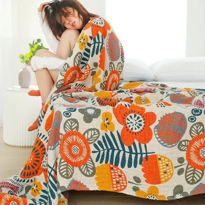 Couverture japonaise en coton double gaze motif floral sur canapé