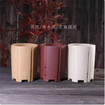 Cache pot céramique moderne rouge beige noir texture granulée fleur plante verteintérieur decoration