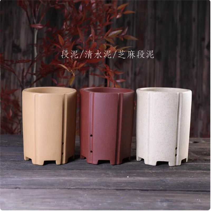 Cache pot céramique moderne rouge beige noir texture granulée fleur plante verteintérieur decoration