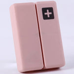 boîte pilules hebdomadaire compartiments couleurs pastel croix blanche moderne pratique