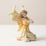 statue fée ailes pastorale fantaisie ornements jardin pot plantes succulentes mousse galets