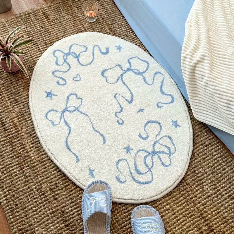 tapis ovale moderne motif rubans étoiles texture douce beige clair bleu pastel résistant décoloration