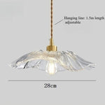 lampe suspendue or transparente motif floral texture ondulée moderne élégante tringle câble