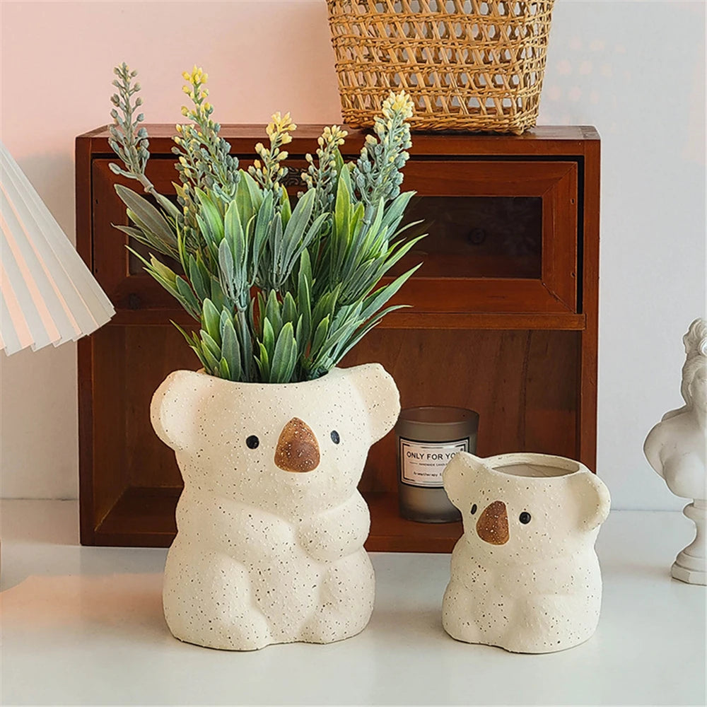 cache pot animalier céramique blanc taches brunes texture gréseuse moderne décoration intérieure plante verte