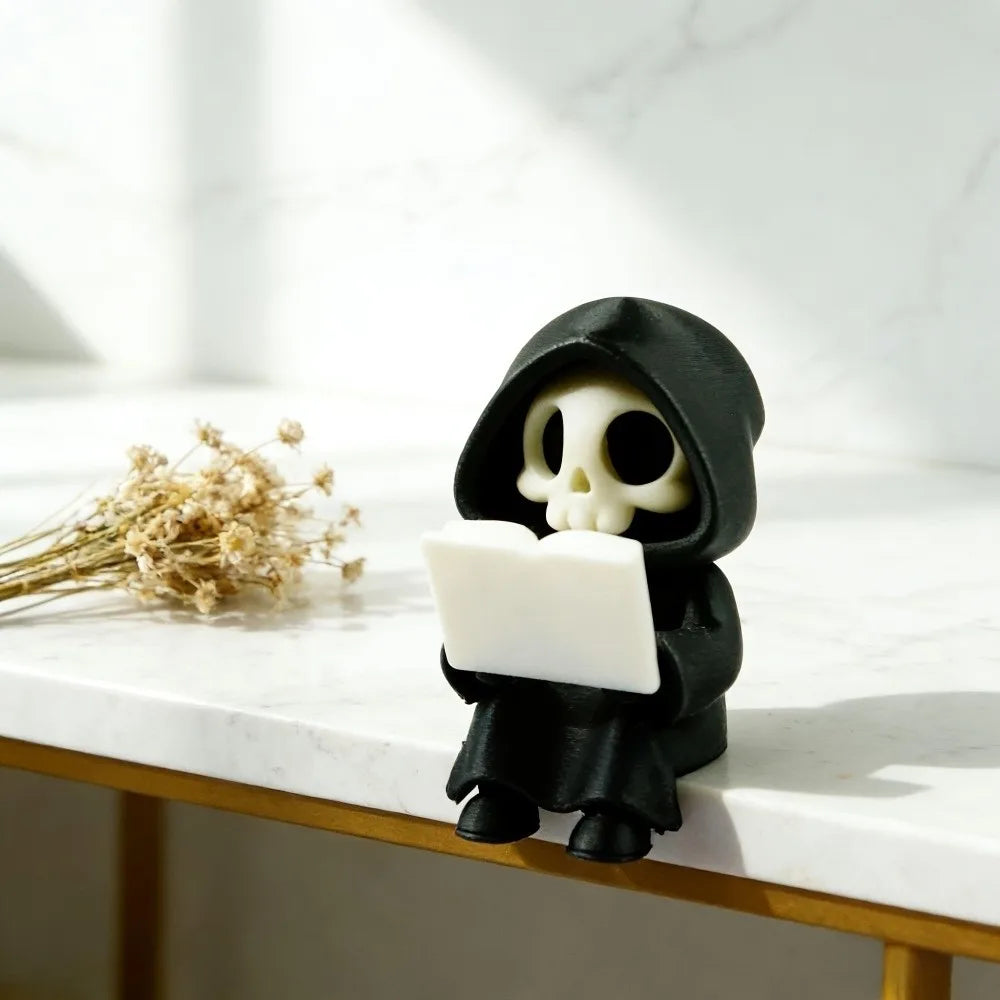 figurine gothique squelette lecture statuette fantôme noire minimaliste texture matestone livre blanc