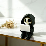 figurine gothique squelette lecture statuette fantôme noire minimaliste texture matestone livre blanc