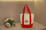 sac main toile verte rouge blanc jaune trader joes logo poignées simple pratique