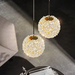 Suspension boule cristal vert salon