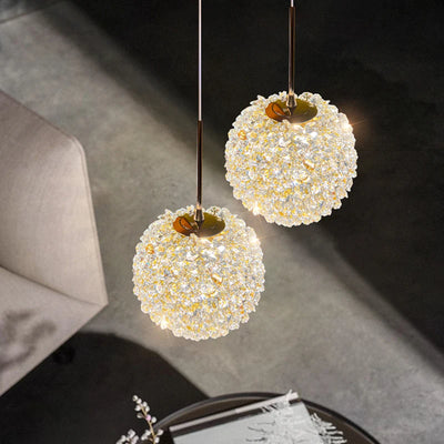 Suspension boule cristal vert salon