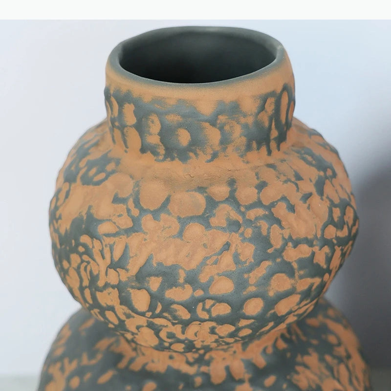 vase céramique brun orange texturé moderne arrangement fleurs séchées décoration table unique sculptural