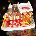 Maison train pain d'épices allumée dans l'obscurité pour ambiance festive