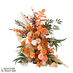 arche décorative boho chic fleurs artificielles orange feuilles vertes franges blanches extérieur mariage anniversaireévénement
