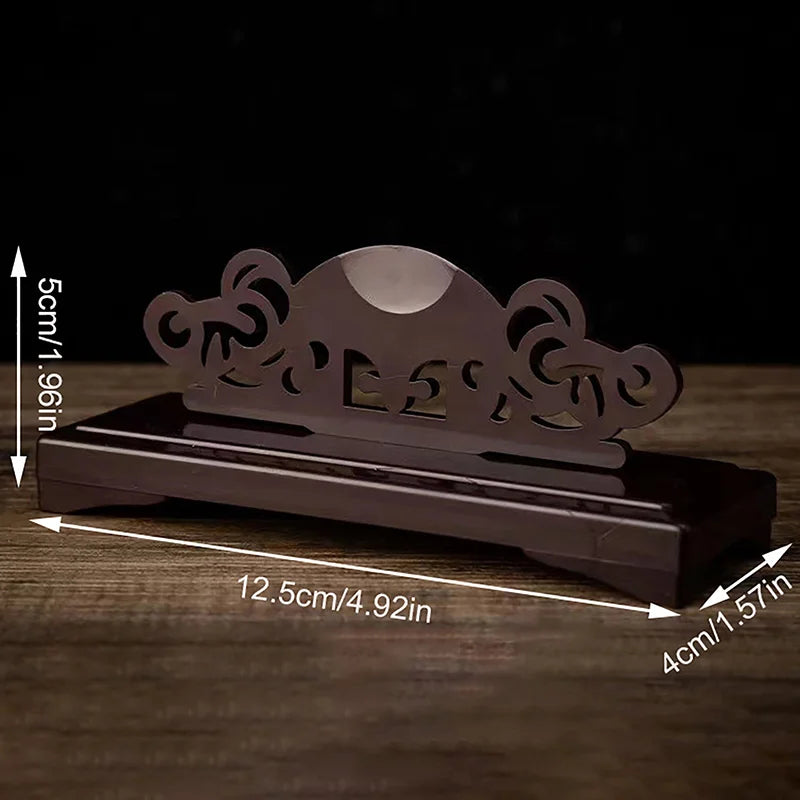 présentation éventail pliant traditionnel rouge rose jaune noir motifs floraux géométriques support bois sculpté