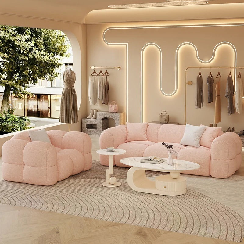 canapé moderne rose clair forme bois tissu doux laine coussins blancs minimaliste confortable