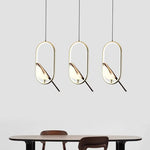 Suspension lumineuse ovale contemporaine oiseau noir doré salon chambre
