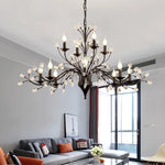 chandelier noir moderne cristaux transparents ampoules blanc chaud suspension élégante branches floralesstylisées